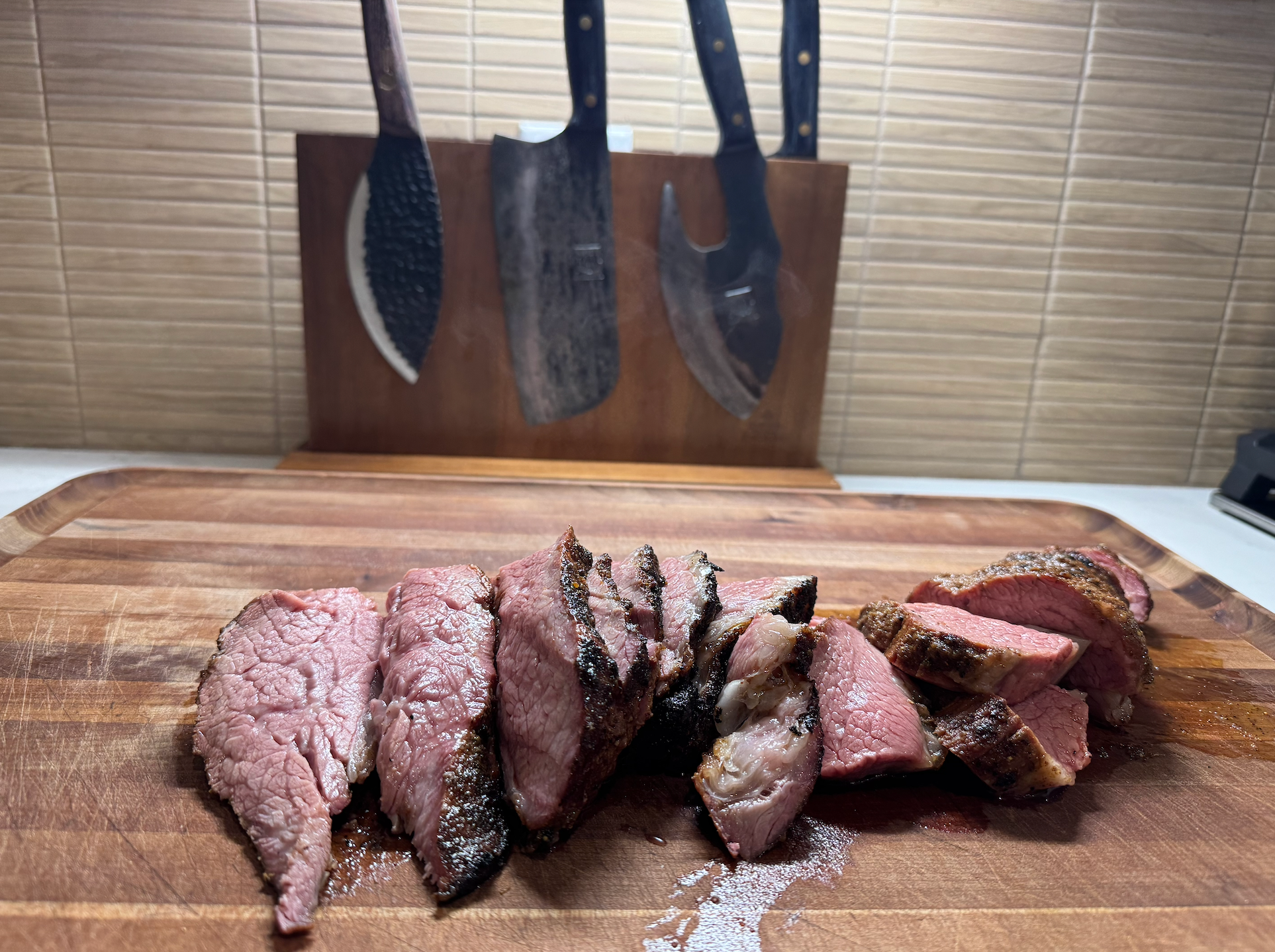 Sliced smoked beef on a cutting board